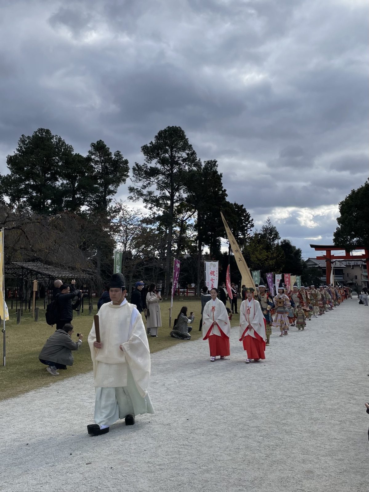 Shinto priest and shrine maidens leading the Yoroi Kizome-shiki procession at Kamigamo Shrine in Kyoto
