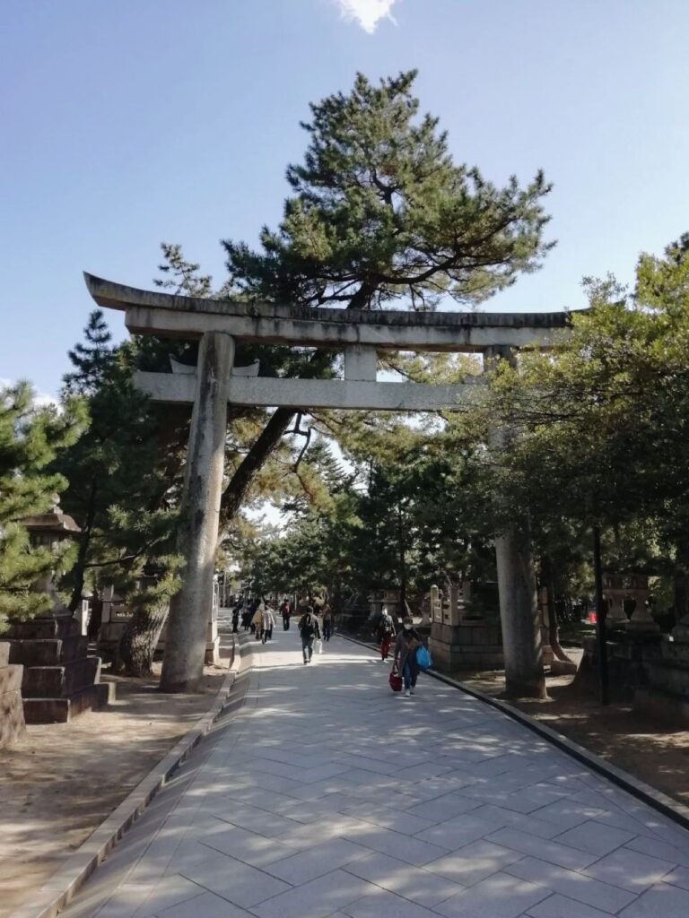 Stone torii at Kitano Tenmangu shrine in Kyoto, where shrine etiquette begins
