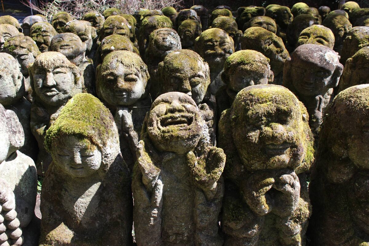 Moss-covered rakan statues at Otagi Nenbutsu-ji, my favourite of all things to do in Arashiyama